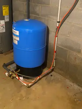Water filtration system installation process showing new filter materials