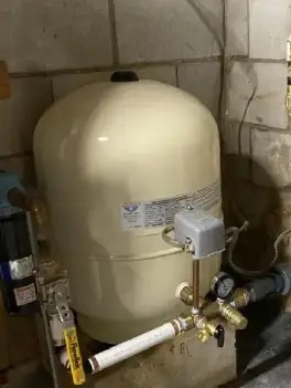 Well pump system installation process showing new pump materials