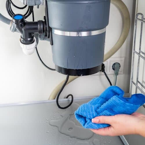 close-up of a leaking garbage disposal