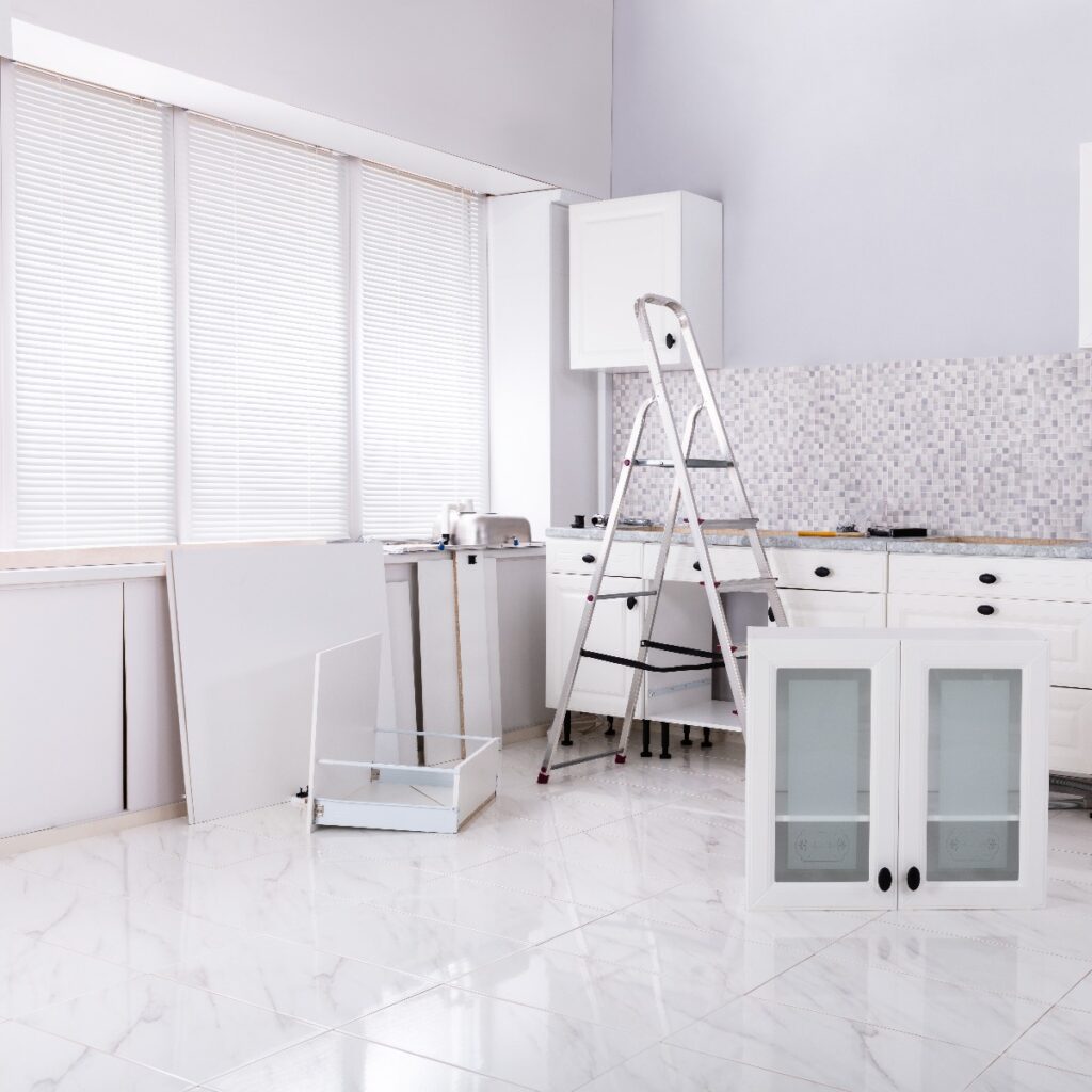Installation Of White Cabinet With Tools And Ladder In The New Modular House